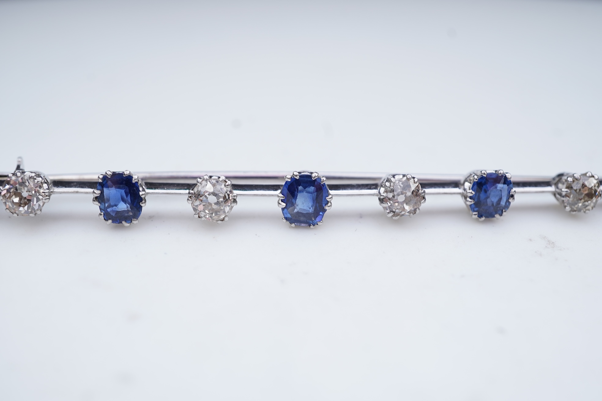 A diamond and sapphire bar brooch, early 20th century